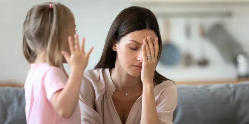 Mom sitting silent and her daughter is crying